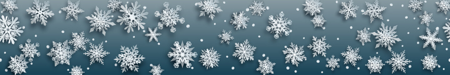 Christmas banner of white complex paper snowflakes with soft shadows on gray background. With horizontal repetition