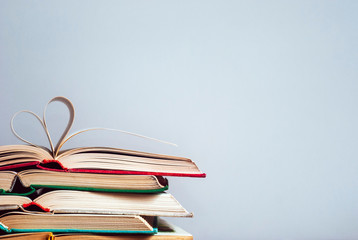 Vintage hardback books on a light background. The concept of education and training. Сopy space.