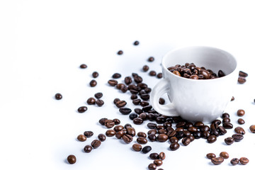Fototapeta na wymiar Cup with coffee bean on white