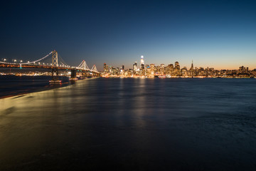 Panoramic beautiful scenic view of the Oakland Bay Bridge and the San Francisco city in the evening, California, USA
