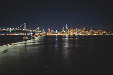 Panoramic beautiful scenic view of the Oakland Bay Bridge and the San Francisco city in the evening, California