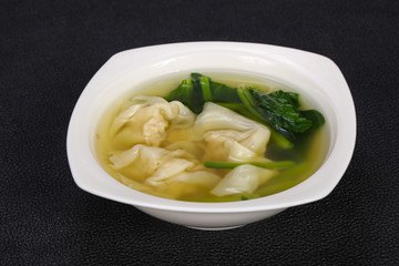 Asian traditional Wonton soup with herbs
