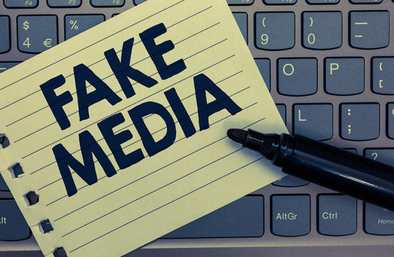 Conceptual hand writing showing Fake Media. Business photo showcasing An formation held by brodcasters which we cannot rely on Notebook paper keyboard Inspiration computer black marker