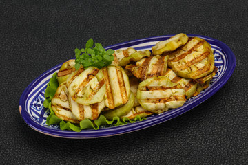 Grilled eggplant slices served basil
