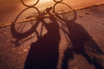 Cyclist shadow on bicycle lane