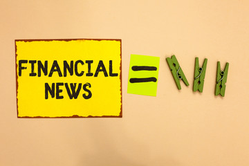 Word writing text Financial News. Business concept for Investment banking Fund management Regulation and trading Yellow piece paper reminder equal sign several clothespins sending message