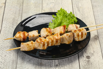 Grilled pork skewer served salad