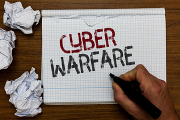 Handwriting text Cyber Warfare. Concept meaning Virtual War Hackers System Attacks Digital Thief Stalker Man holding marker notebook crumpled papers ripped pages mistakes made