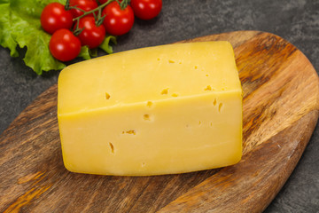 Hard yellow tasty cheese brick