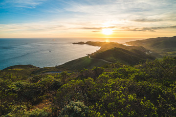 Beautiful scenic sunset view over Marin Headlands and the Pacific Ocean near San Francisco, California, USA - obrazy, fototapety, plakaty