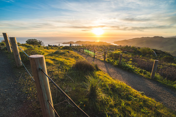 Beautiful scenic sunset view over Marin Headlands and the Pacific Ocean near San Francisco, California, USA - obrazy, fototapety, plakaty