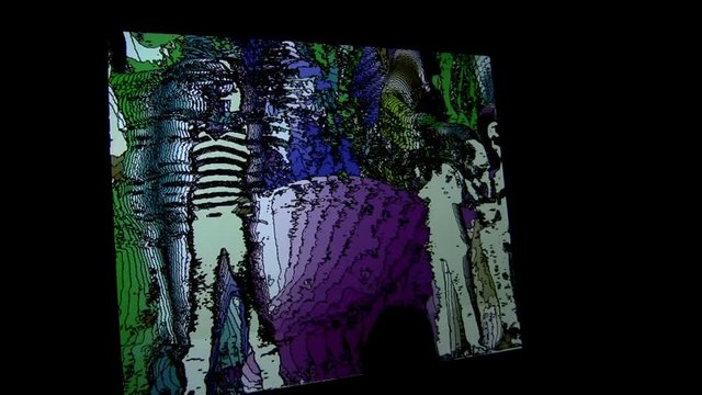 A psychedelic screen where kids play in front of and see themselves on the larger picture.