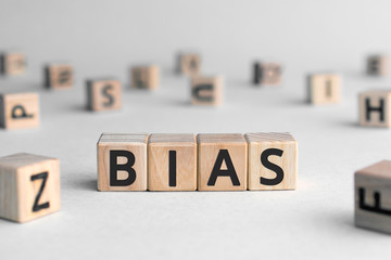 Bias - word from wooden blocks with letters, personal opinions prejudice bias concept, random...