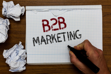 Handwriting text B2B Marketing. Concept meaning Partnership Companies Supply Chain Merger Leads Resell Man holding marker notebook crumpled papers ripped pages mistakes made