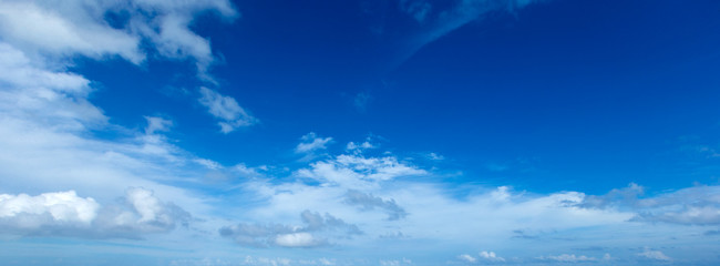 blue sky background with tiny clouds