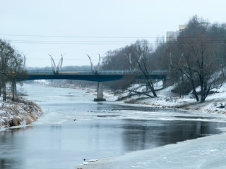 gray winter landscape, river bridge, fog, Valmiera, Latvia