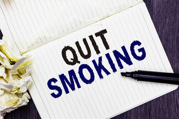 Conceptual hand writing showing Quit Smoking. Business photo text Discontinuing or stopping the use of tobacco addiction Marker over notebook crumpled papers several tries mistakes