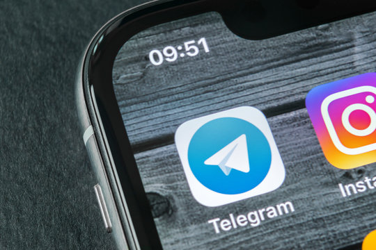 Sankt-Petersburg, Russia, April 11, 2018: Telegram application icon on Apple iPhone X screen close-up. Telegram app icon. Telegram is an online social media network. Social media app