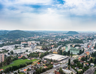 City Graz aerial view with district Gösting and hill Schloßberg