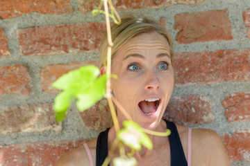 Excites blond woman reacting in amazement
