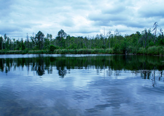 Fototapeta na wymiar Photography of stunning landscape with a beautiful lake in Skovde Sweden, Europe