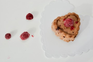 Tasty raspberry vegan muffins on the white table