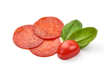 Spanish spicy Chorizo Sausage slices, close-up, isolated on white background