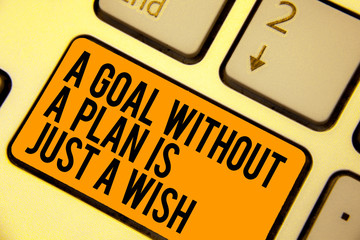 Handwriting text writing A Goal Without A Plan Is Just A Wish. Concept meaning Make strategies to reach objectives Keyboard orange key Intention create computer computing reflection document