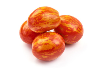 Fresh colorful sweet rustic tomatoes, isolated on white background