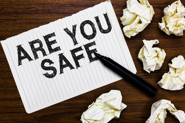 Text sign showing Are You Safe. Conceptual photo Free from danger Not anticipating any Harm Hurt physically Marker over notebook crumpled papers ripped pages several tries mistakes