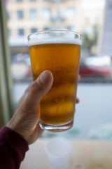 amber ale beer in hand