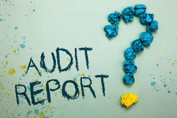 Handwriting text Audit Report. Concept meaning An appraisal of complete financial status of a business Assets Crumpled papers forming question mark several tries unanswered doubt