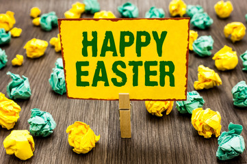 Conceptual hand writing showing Happy Easter. Business photo text Christian feast commemorating the resurrection of Jesus Clothespin holding yellow note paper crumpled papers mistakes
