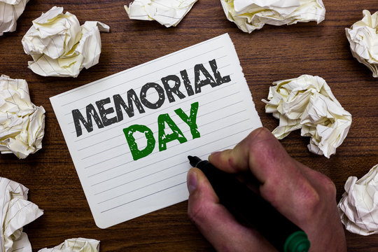Conceptual hand writing showing Memorial Day. Business photo showcasing To honor and remembering those who died in military service Man holding marker notebook page crumpled papers mistakes