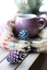 Obraz na płótnie Canvas Cup of coffee on the window background, warm scarf, New Year's decor, winter seasonal holidays, Christmas, home comfort concept