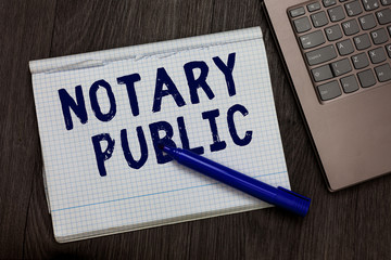 Conceptual hand writing showing Notary Public. Business photo text Legality Documentation Authorization Certification Contract Open notebook squared page black marker computer wooden background