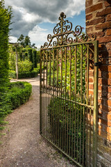 Old iron gate at Hampton Court Castle gardens Hope under Dinmore Herefordshire England
