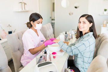 Obraz premium Happy Female Customer At Nail Spa