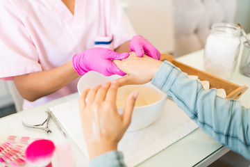 Obraz na płótnie Canvas Cosmetic Beauty Treatment Of Hands In Nail Spa