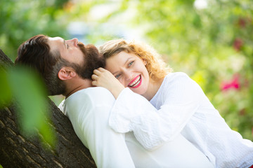 Fototapeta premium Young tender lover enjoys touching soft skin of sensual sexy lady. Trust in love. Sensual girl moaning with desire caressing boyfriend during foreplay or making love.