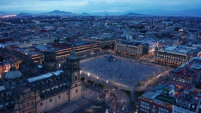 evening flying counter clockwise opposite National Palace around Mexico City Zocalo