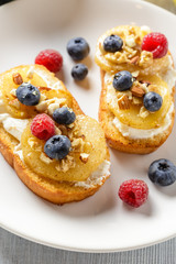 Toasts with pear, cream cheese, nuts and honey.