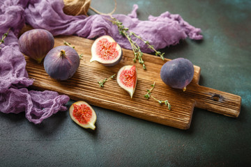 Juicy fig fruits on a dark background