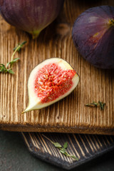 Juicy fig fruits on a dark background