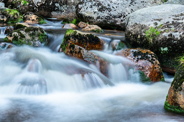 Mountain rocky river flow. Long exposure shot