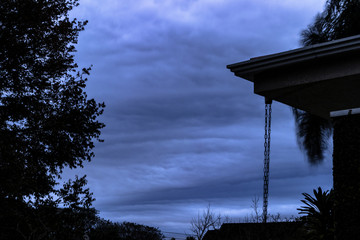 Cloudy Sky in a Rainy Day and house roof