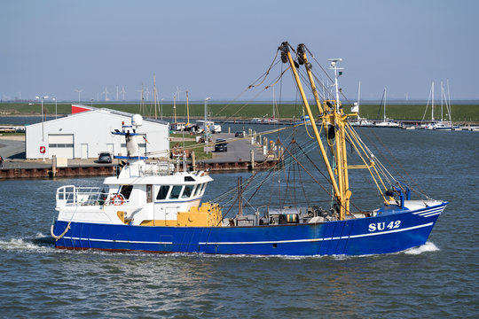 B&Uuml;SUM, GERMANY - GERMANY - APRIL 8, 2019: fishing vessel SU42 HOPE leaving the port of B&uuml;sum, Germany