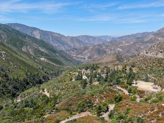 Fototapeta na wymiar Aerial view of Angeles National Forests mountain, California, USA. Green mountain during hot summer season