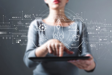 Agile concept with business woman using a tablet computer