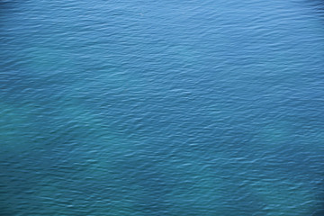 beautiful texture of sea water surface with light ripples, blank for designer, blank for postcard, copy space